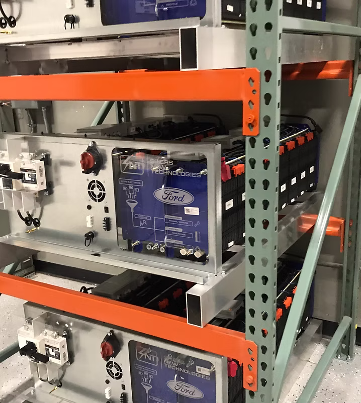Ford Tower of Power second-life battery system with stacked battery modules and control hardware.