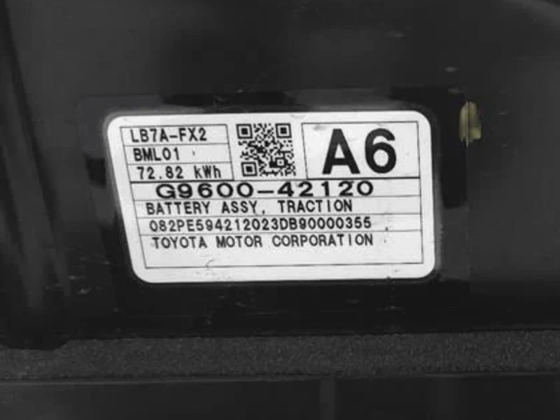 Close-up of the Toyota traction-battery assembly label showing part number G9600-42120 and rated energy of 72.82 kWh