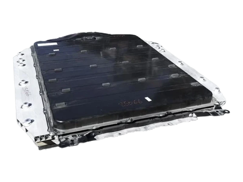 Three-quarter exterior view of a Subaru Solterra EV battery pack showing the enclosure, mounting rails, cover, and visible completeness